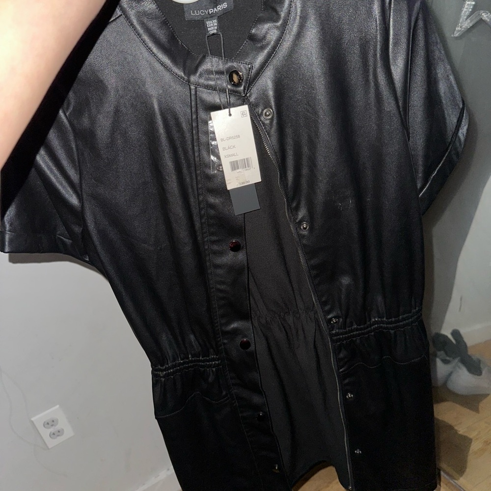 Lucy Paris Black Leather Jacket with Short Sleeves and Zipper Closure